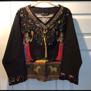 Embroidered pullover top.